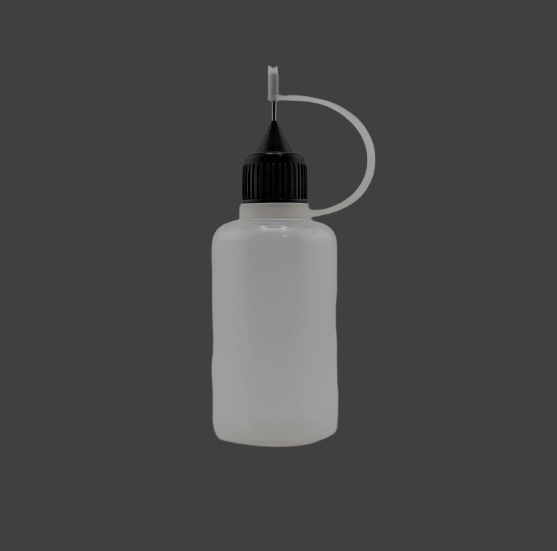 Clear plastic bottle with black cap on a gray background
