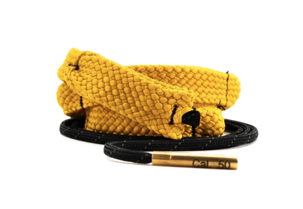 Coiled yellow and black rope with a brass end on a white background.
