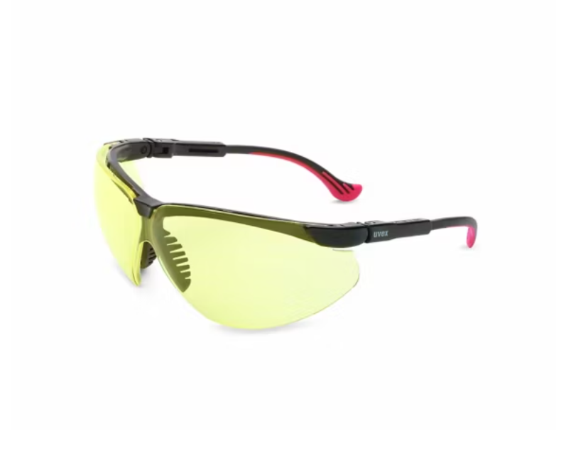 Safety glasses with yellow lenses and black frames on a white background