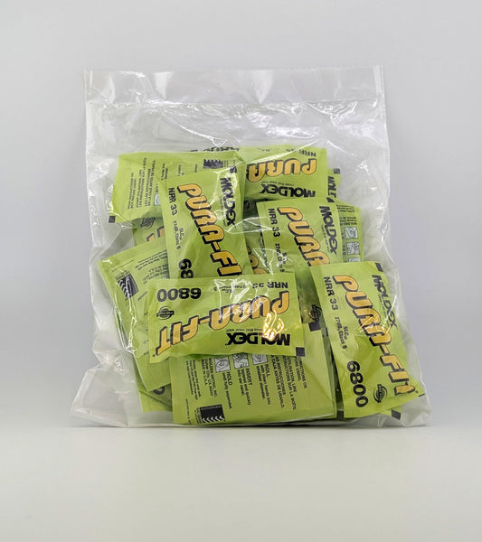 Clear plastic bag filled with individual packets of earplugs on a white background