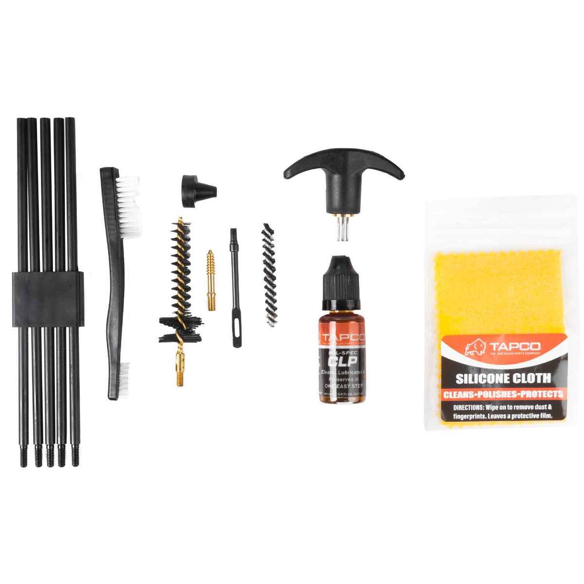 Gun cleaning kit with various tools and a bottle of lubricant on a white background