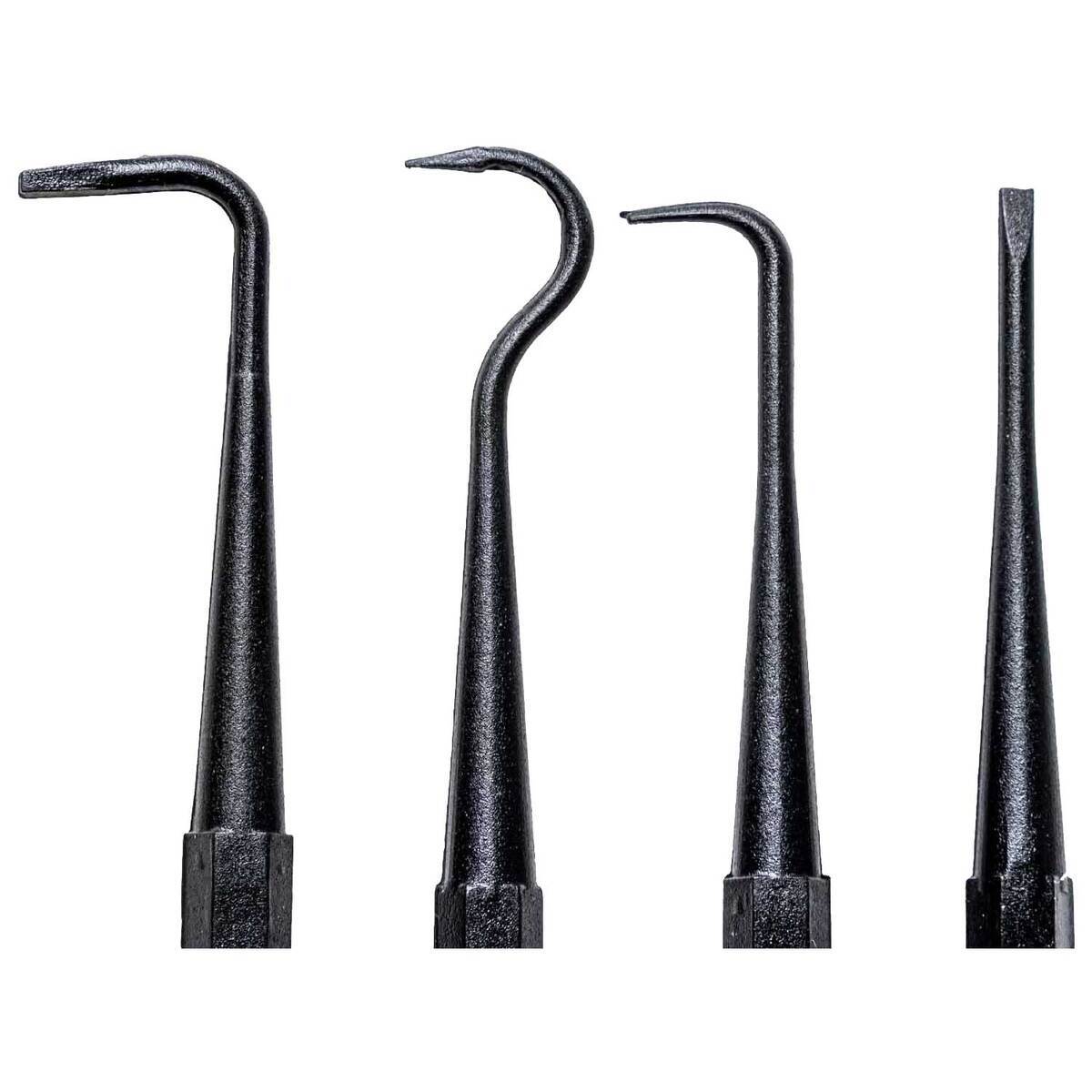 Set of four black dental tools on a white background